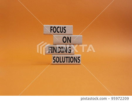 Focus on finding solutions symbol. Concept words Focus on finding solutions on wooden blocks. Beautiful orange background. Business and Focus on finding solutions concept. Copy space Focus on finding solutions symbol. Concept words Focus on finding solutions on wooden blocks. Beautiful orange background. Business and Focus on finding solutions concept. Copy space 95972209