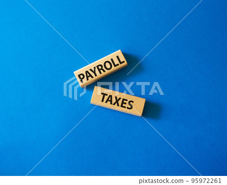 Payroll taxes symbol. Concept word Payroll taxes on wooden blocks. Beautiful blue background. Business and Payroll taxes concept. Copy space Payroll taxes symbol. Concept word Payroll taxes on wooden blocks. Beautiful blue background. Business and Payroll taxes concept. Copy space 95972261