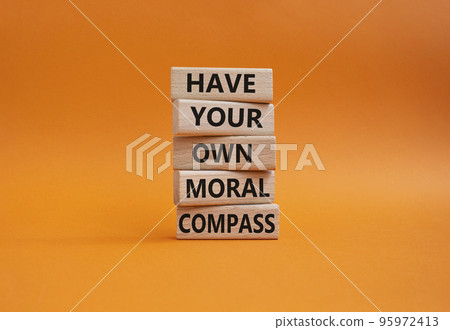Have your own moral compass symbol. Business Concept words Have your own moral compass on wooden blocks. Beautiful orange background. Business and Have your own moral compass concept. Copy space Have your own moral compass symbol. Business Concept words Have your own moral compass on wooden blocks. Beautiful orange background. Business and Have your own moral compass concept. Copy space 95972413