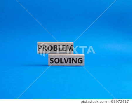 Problem solving symbol. Concept word Problem solving on wooden blocks. Beautiful blue background. Business and concept. Copy space Problem solving symbol. Concept word Problem solving on wooden blocks. Beautiful blue background. Business and concept. Copy space 95972417