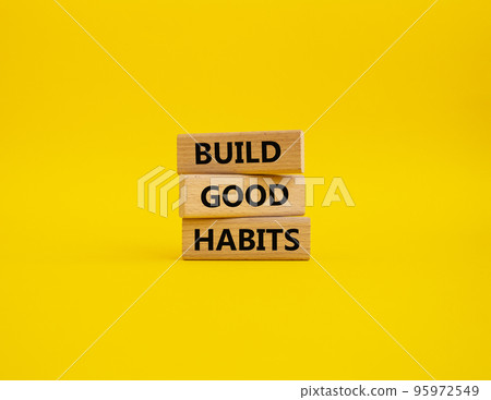 Build good habits symbol. Wooden blocks with words 'Build good habits'. Beautiful yellow background. Business and 'Build good habits' concept. Copy space. Build good habits symbol. Wooden blocks with words 'Build good habits'. Beautiful yellow background. Business and 'Build good habits' concept. Copy space. 95972549