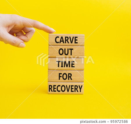 Carve out time for recovery symbol. Wooden blocks with words Carve out time for recoveryg. Beautiful yellow background. Businessman hand. Business and Carve out time for recovery concept. Copy space. 95972586