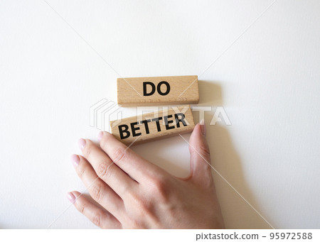 Do better symbol. Wooden blocks with words Do better. Beautiful white background. Businessman hand. Business and Do better concept. Copy space. Do better symbol. Wooden blocks with words Do better. Beautiful white background. Businessman hand. Business and Do better concept. Copy space. 95972588
