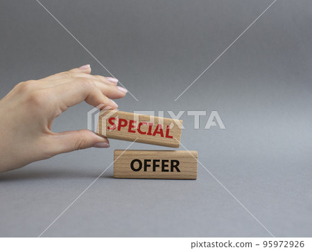 Special offer symbol. Concept word Special offer on wooden blocks. Beautiful grey background. Businessman hand. Business and Special offer concept. Copy space Special offer symbol. Concept word Special offer on wooden blocks. Beautiful grey background. Businessman hand. Business and Special offer concept. Copy space 95972926