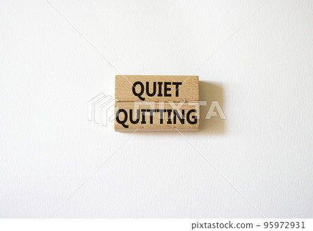 Quiet quitting symbol. Concept word Quiet quitting on wooden blocks. Beautiful white background. Business and Quiet quitting concept. Copy space. Quiet quitting symbol. Concept word Quiet quitting on wooden blocks. Beautiful white background. Business and Quiet quitting concept. Copy space. 95972931