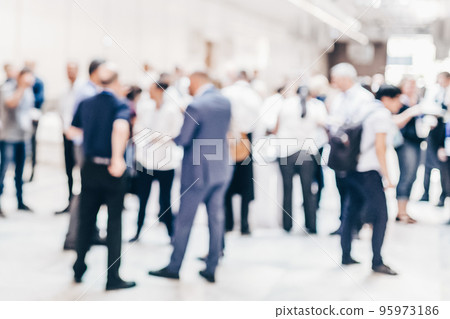 Abstract blurred people socializing during coffee break at business conference. 95973186
