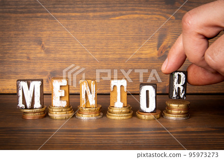 Mentor concept. Change and alphabet letter blocks on wood texture background 95973273