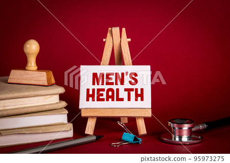 Men's Health. Miniature easel with text on doctor's desk 95973275