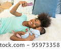 Young mother and newborn baby making video call and smiling greet 95973358