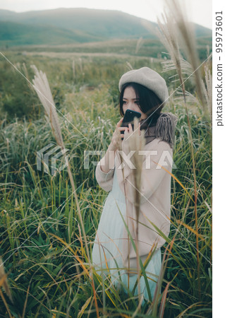 Photo of a woman standing in nature 95973601