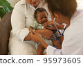 Newborn baby crying sick visiting the doctor for checkup health 95973605