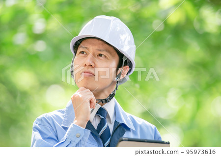 Male portrait in helmet work clothes Male portrait in helmet work clothes 95973616