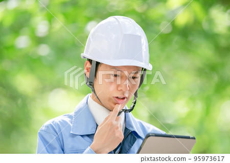Male portrait in helmet work clothes Male portrait in helmet work clothes 95973617
