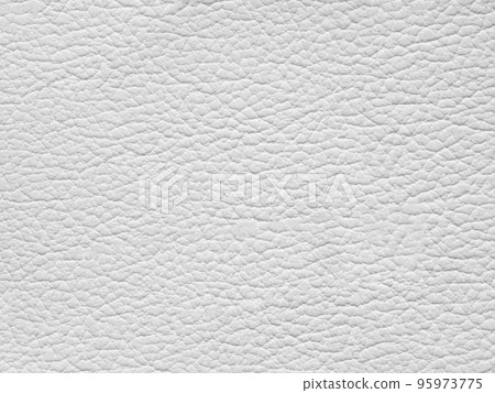 White leather texture sample. Genuine leather closeup in light white tone. Backdrop textured effect for design, upholstered furniture, clothing. Faux eco leather. Background with copy space, top view. 95973775