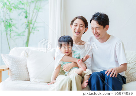 Portrait of a young family holding a boy 95974089