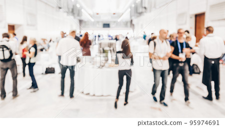 Abstract blurred people socializing during buffet lunch break at business meeting or conference. 95974691