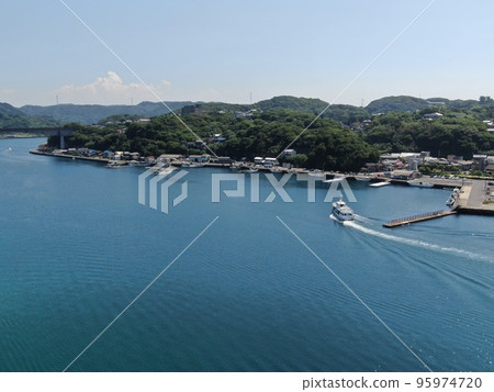 Aerial view of fishing boats entering the fishing port of Nagoyaura in Yobuko Aerial view of fishing boats entering the fishing port of Nagoyaura in Yobuko 95974720
