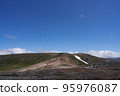 Two climbers walking on a rocky trail from Mt. Kumagatake to Mt. Mamiya 95976087