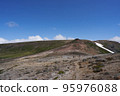 Two climbers walking on a rocky trail from Mt. Kumagatake to Mt. Mamiya 95976088