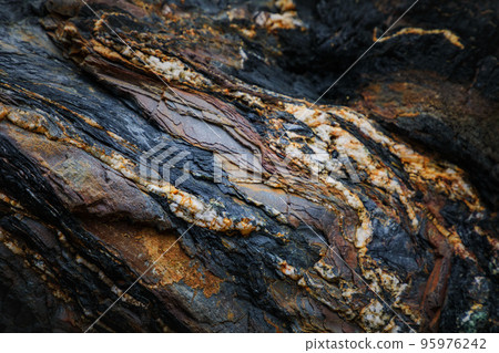 Rocky shapes on the beach. textures and patterns generated on the stones of the Asturian beaches Rocky shapes on the beach. textures and patterns generated on the stones of the Asturian beaches 95976242