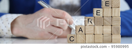 Career text on wooden cubes and growth up closeup Career text on wooden cubes and growth up closeup 95980995