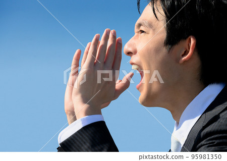 Image of a man in a suit calling or shouting in a loud voice Image of a man in a suit calling or shouting in a loud voice 95981350