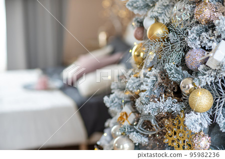 Christmas Tree with Decoration On A Winter Background With Bright Lights 95982236