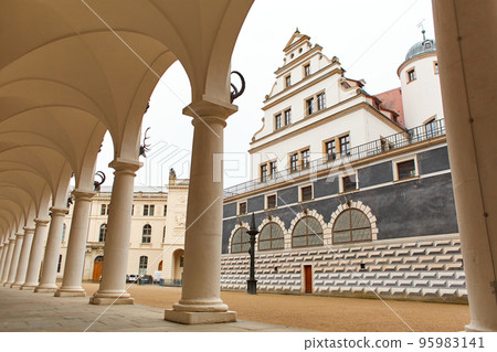 The territory of the old horse yard. The architecture of the building with a colonnade along the entire facade in the Baroque style 95983141