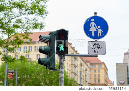 Traffic light for pedestrians with the figure of a walking man, lights green 95983154