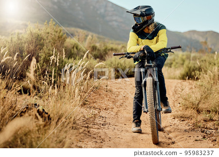 Mountain bike, sports and nature man in fitness adventure, travel and journey in Australia dirt path for marathon, race or training. Cycling man on bicycle with safety helmet gear for outdoor sport Mountain bike, sports and nature man in fitness adventure, travel and journey in Australia dirt path for marathon, race or training. Cycling man on bicycle with safety helmet gear for outdoor sport 95983237