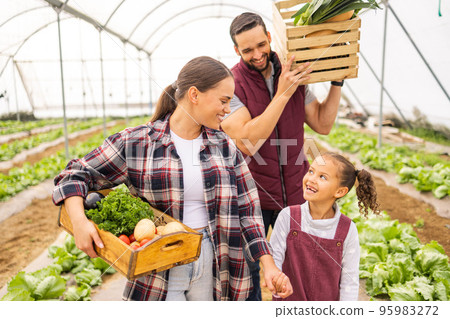 Food, agriculture and sustainability with family on farm for learning, environment and help. Health, nature and garden with parents and girl farmer with vegetables box in field for plant and growth Food, agriculture and sustainability with family on farm for learning, environment and help. Health, nature and garden with parents and girl farmer with vegetables box in field for plant and growth 95983272