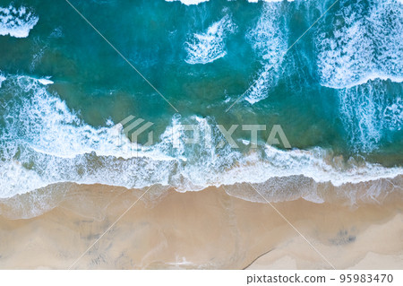 Aerial view of sea crashing waves White foaming waves on beach sand, Top view beach seascape view Nature sea ocean background 95983470