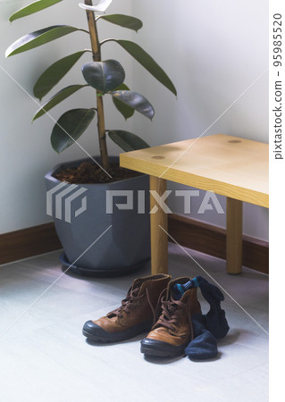 leather shoe and used socks put at foyer at the home. leather shoe and used socks put at foyer at the home. 95985520