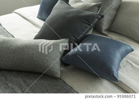 Luxurious dark blue sofa with cushions. Contemporary furniture. 95986071