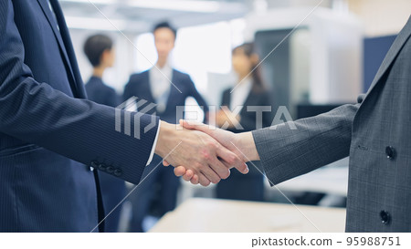 Business group shaking hands in the office Business group shaking hands in the office 95988751