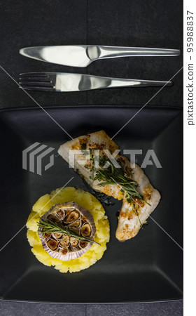 cod fillet with couscous and roasted garlic cod fillet with couscous and roasted garlic 95988837