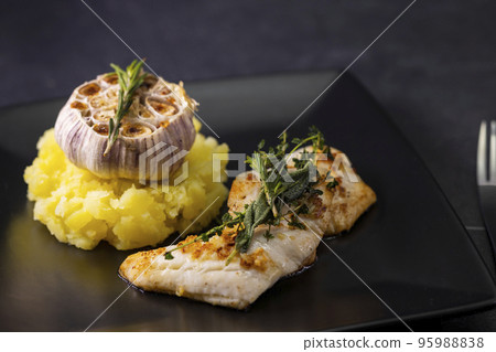 cod fillet with couscous and roasted garlic cod fillet with couscous and roasted garlic 95988838