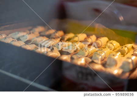 The process of making homemade croissants and other pastries at home. 95989036