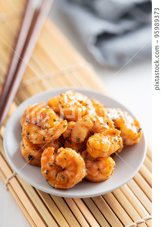 Grilled tiger shrimps on plate. 95989373