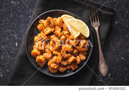 Grilled tiger shrimps on plate. Top view. Grilled tiger shrimps on plate. Top view. 95989382