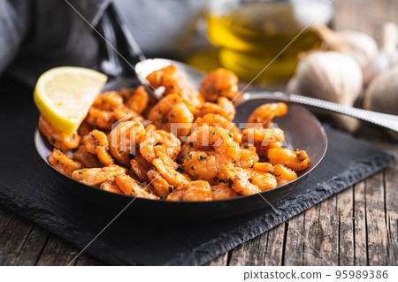 Grilled tiger shrimps on pan. Grilled tiger shrimps on pan. 95989386