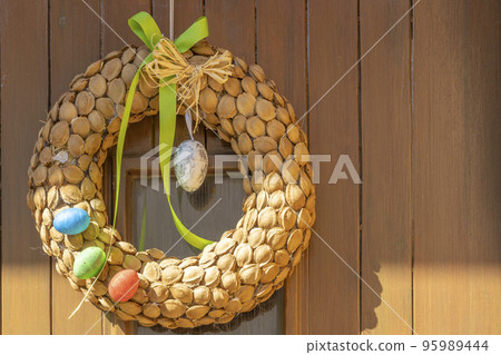 Easter wreath on the door Easter wreath on the door 95989444