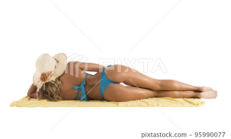 Girl on a beach towel Girl on a beach towel 95990077