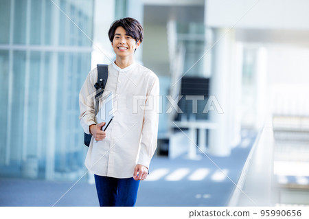College student walking on campus College student walking on campus 95990656