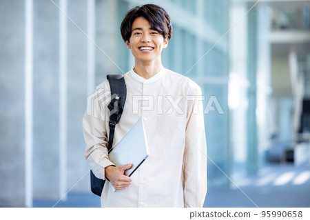 College student walking on campus College student walking on campus 95990658