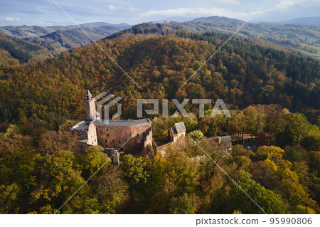 Aerial top view of Grodno castle in Zagorze with beautiful autumn landscape. Old historical fortress in mountains, covered with forest. Poland landmarks for tourists 95990806