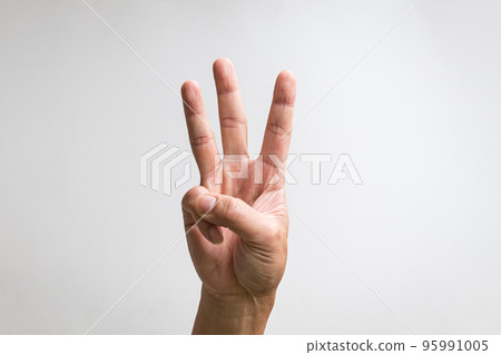 Pointing up with fingers number three. Pointing up with fingers number three. 95991005
