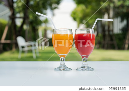 Orange juice and Watermelon juice on the natural background 95991865