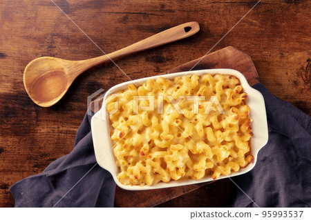 Macaroni and cheese pasta in a casserole dish, oven baked, top shot Macaroni and cheese pasta in a casserole dish, oven baked, top shot 95993537