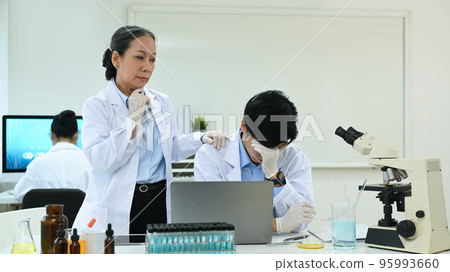 Image go carrying senior woman comforting stressed male having problems results of the experiment Image go carrying senior woman comforting stressed male having problems results of the experiment 95993660